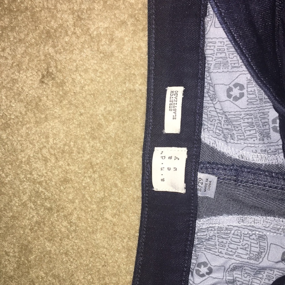 Dark navy flare jeans. I’m not sure of the brand.